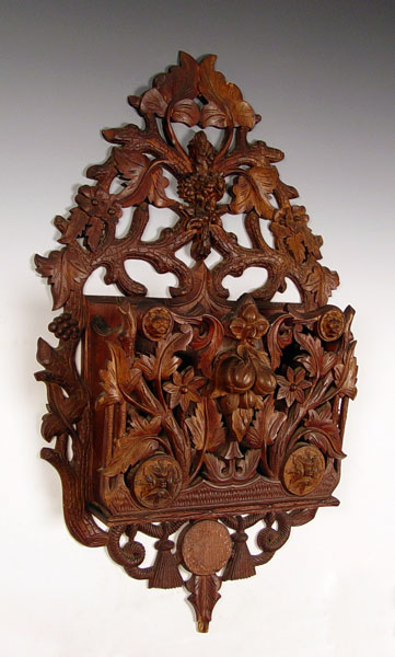 Appraisal: ORNATELY CARVED VICTORIAN HANGING MAGAZINE RACK Profusely carved with rope