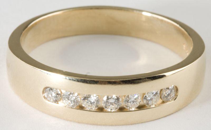 Appraisal: KT Gentleman's Diamond Ring channel set with round brilliant cut