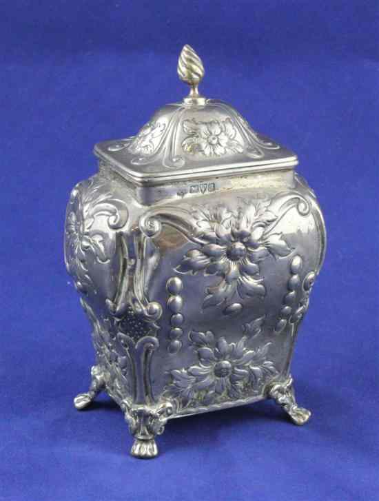 Appraisal: An Edwardian embossed silver tea caddy of restrained bombe shape