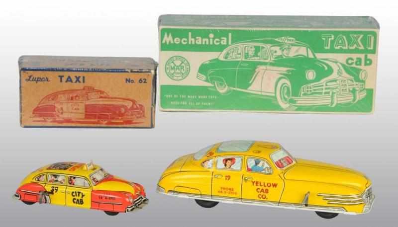 Appraisal: Lot of Tin Taxi Wind-Up Toys Description American Working Includes