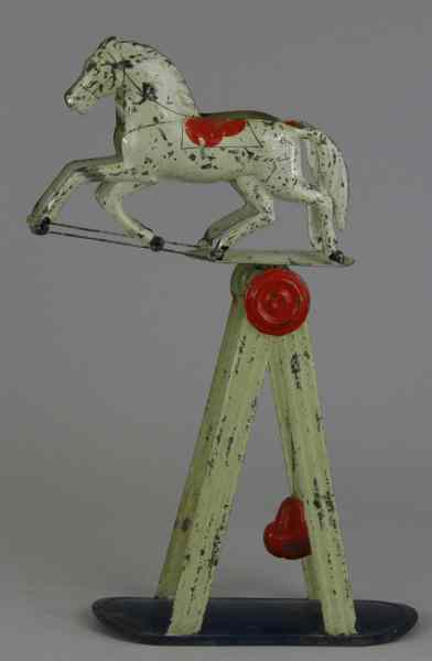 Appraisal: MERRIAM BALANCING HORSE TOY Pat Jan early American tin toy