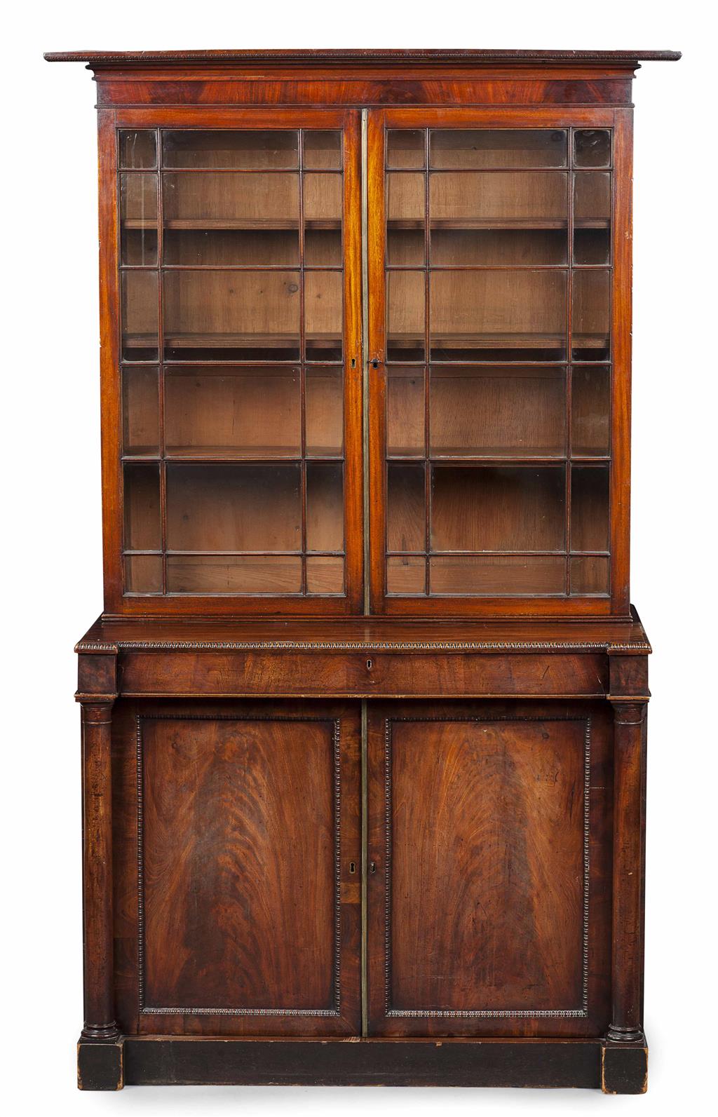 Appraisal: REGENCY MAHOGANY BOOKCASE CIRCA the moulded cornice above a pair