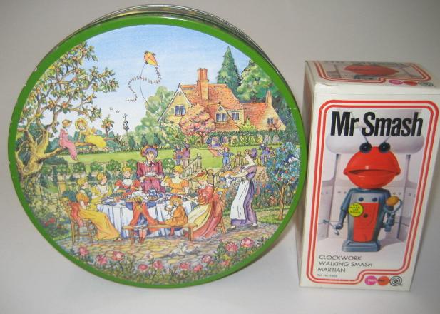 Appraisal: A Huntley Palmers Rude biscuit tin the lid displaying a