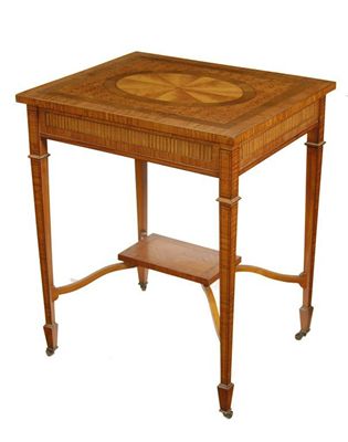 Appraisal: An Edwardian satinwood occasional table the rectangular top inlaid a