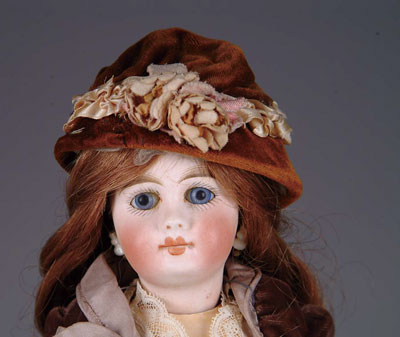 Appraisal: CLOSED-MOUTH BELTON DOLL A closed-mouth Belton-type with blue paperweight eyes