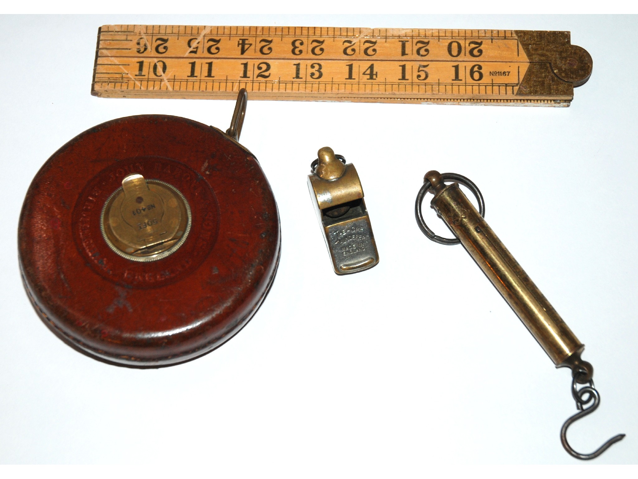 Appraisal: A Rabone Sons tape measure The Acme Thunderer whistle a