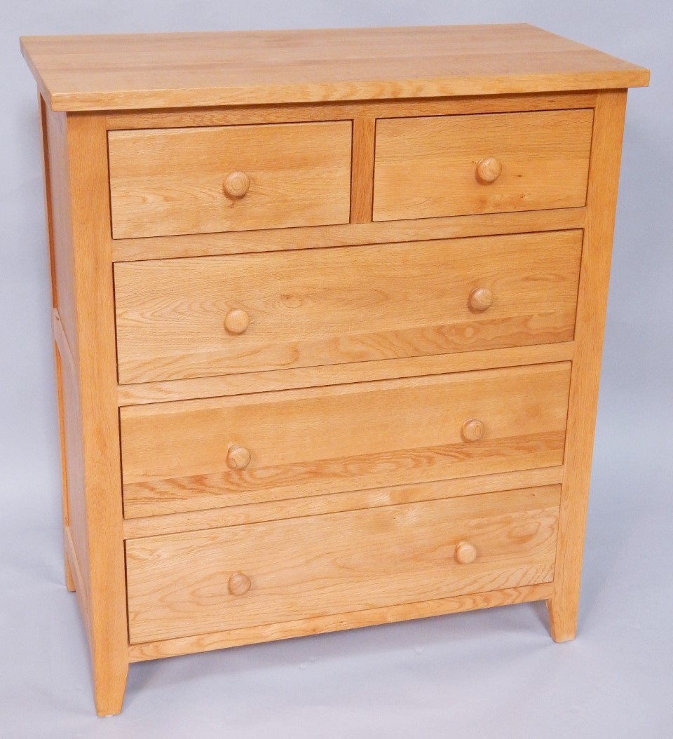 Appraisal: A light oak chest of two short over three long