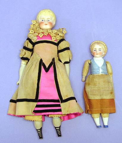 Appraisal: Pair of dolls German peasant doll with blonde braided molded