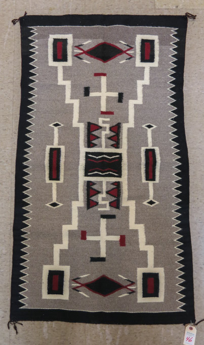 Appraisal: NAVAJO WEAVING a hand woven storm pattern attributed to the