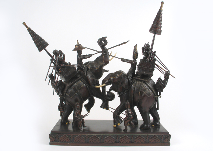 Appraisal: AN INDONESIAN HARDWOOD FIGURAL SCULPTURE depicting two battle elephants with