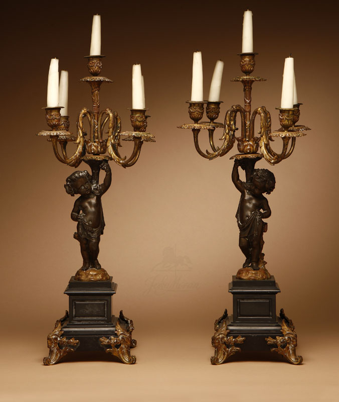 Appraisal: A pair of Louis XVI style gilt and patinated bronze