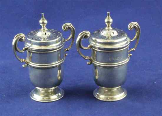 Appraisal: A pair of late Victorian silver two handled pepperettes of