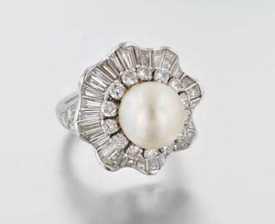 Appraisal: A Platinum Diamond and Pearl Dinner Ring Platinum ballerina style