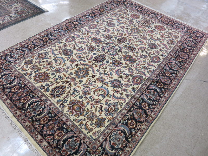 Appraisal: HAND KNOTTED ORIENTAL CARPET Indo-Persian overall floral decoration on rectangular