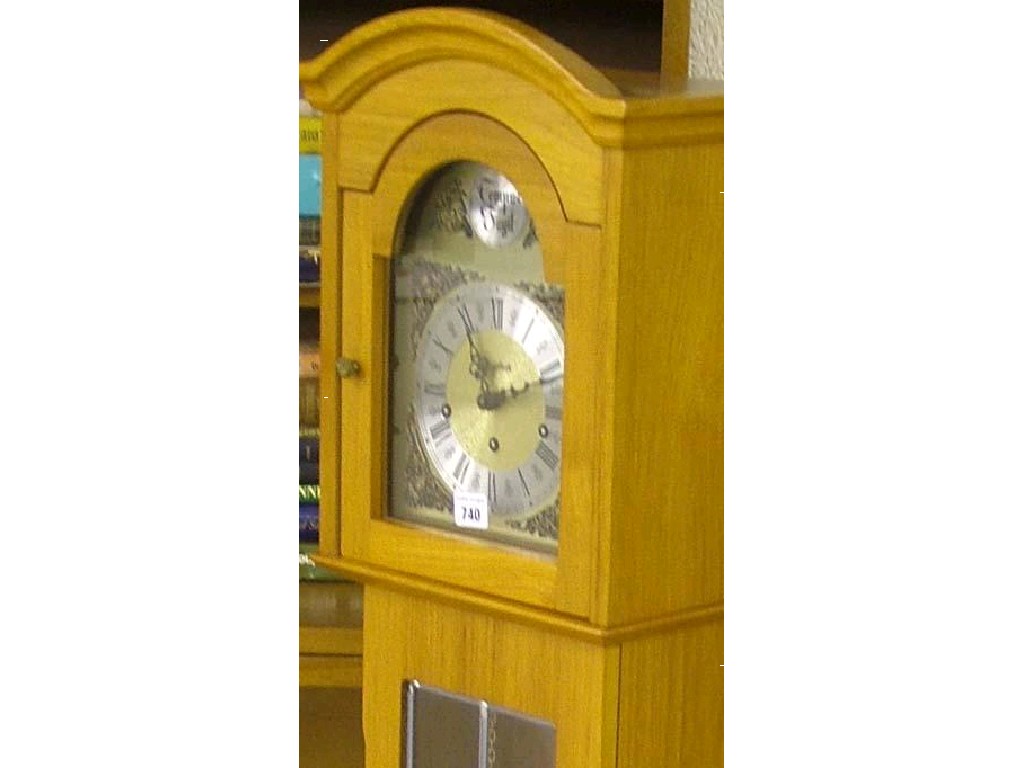 Appraisal: Contemporary German three train grandmother clock the brass arched dial