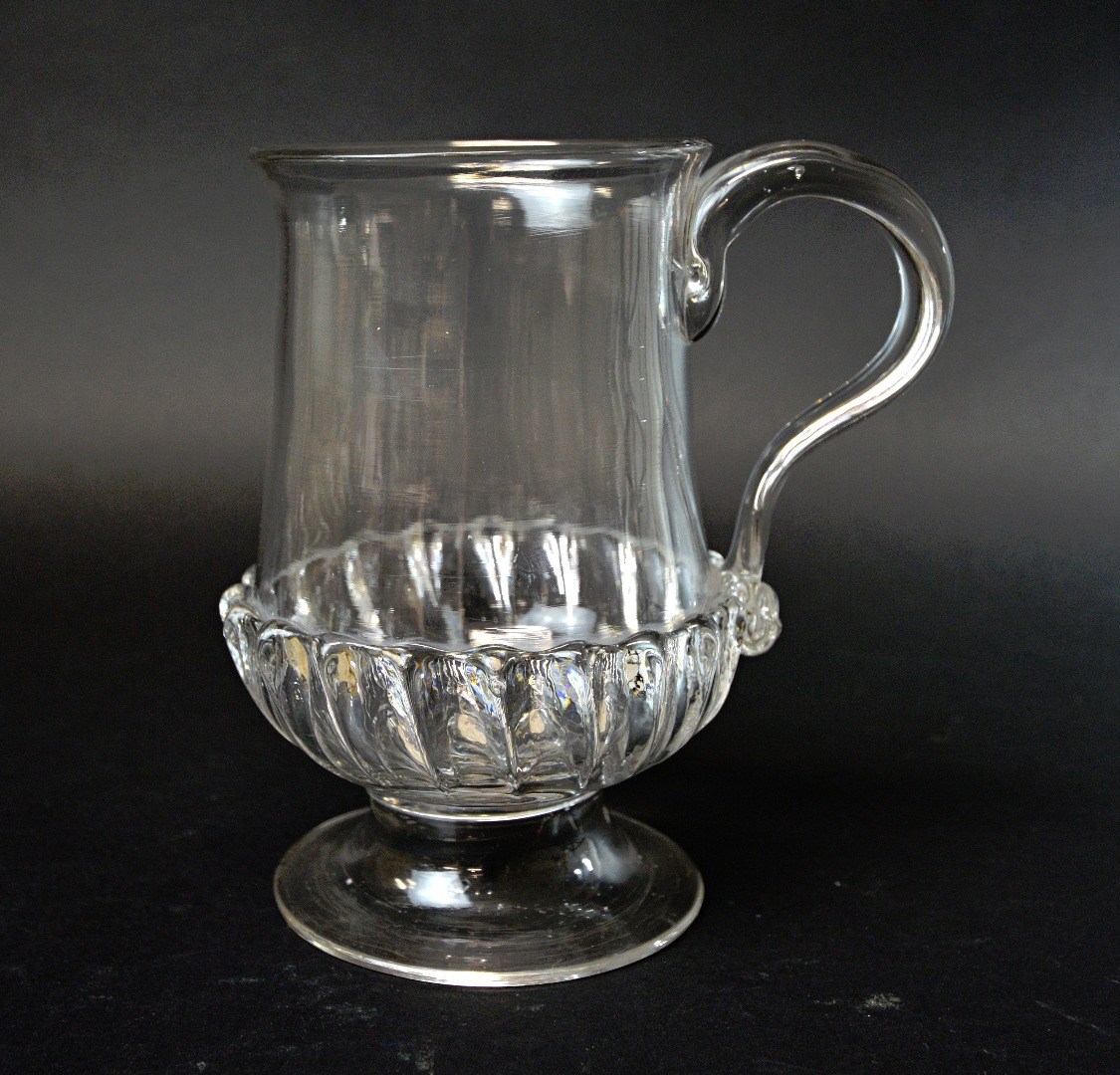 Appraisal: An English glass coin tankard late th century with a