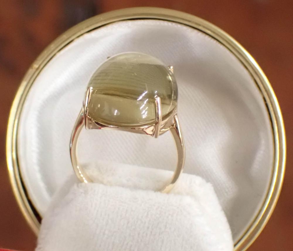 Appraisal: YELLOW LABRADORITE AND FOURTEEN KARAT GOLD RING The solitaire ring