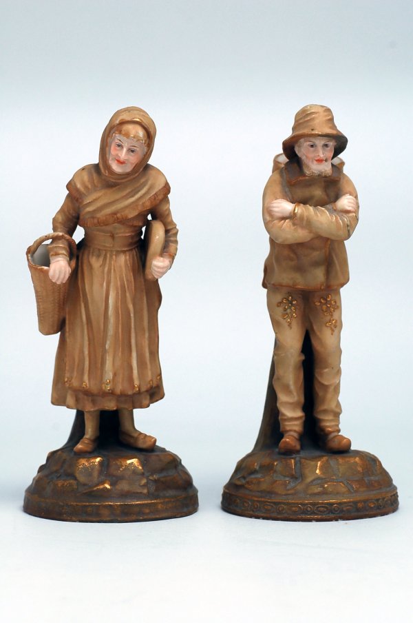 Appraisal: Circa to pair of figurines of a peasant man and