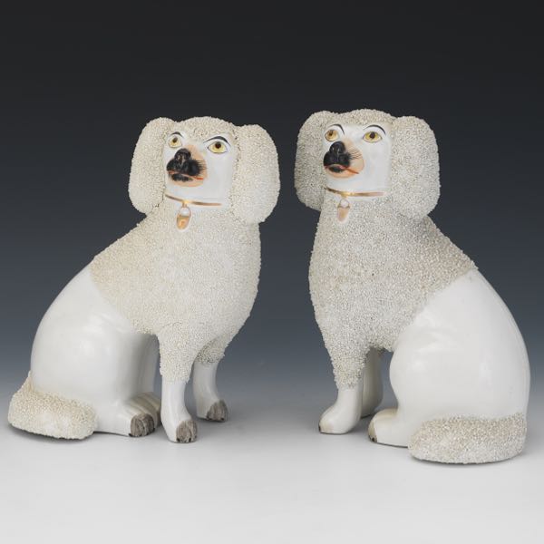 Appraisal: PAIR OF STAFFORDSHIRE POODLES x Two seated poodles with grated