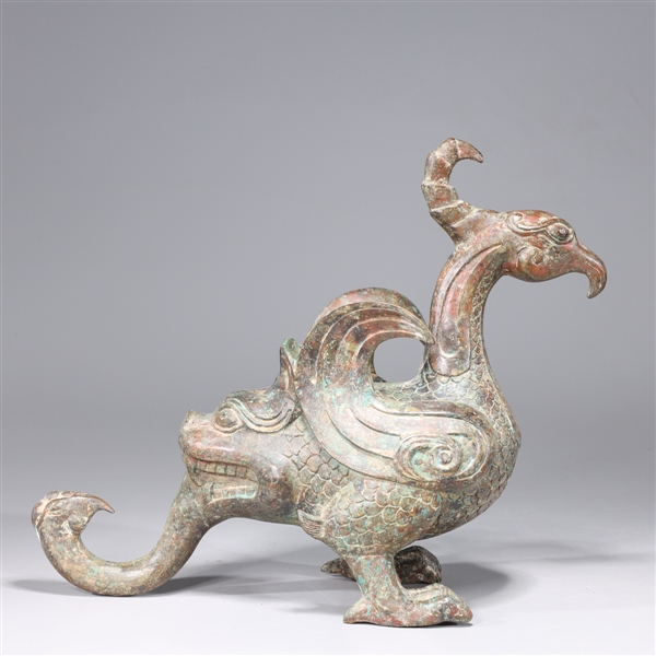 Appraisal: Chinese archaistic bronze model of a bird with intricately incised