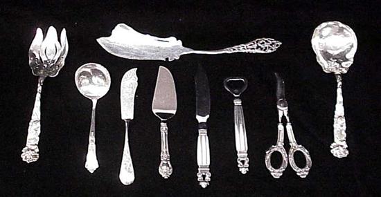 Appraisal: STERLING Floral repousse salad fork and spoon grape shears ladle