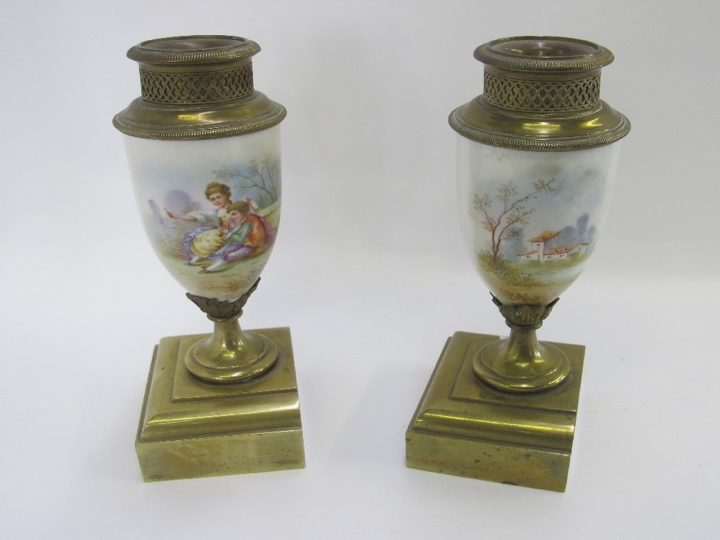 Appraisal: Pair of garnitures with handpainted decoration of courting couples