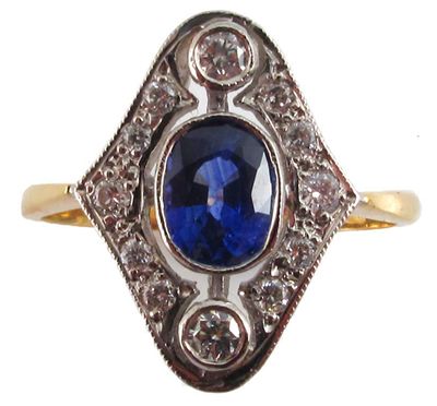 Appraisal: A sapphire and diamond plaque ring Centred with an oval