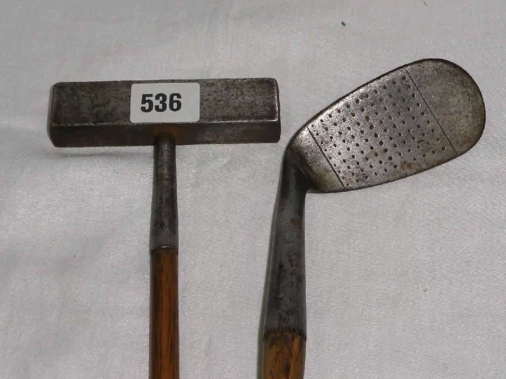 Appraisal: Two Hickory shafted vintage golf clubs one an iron the