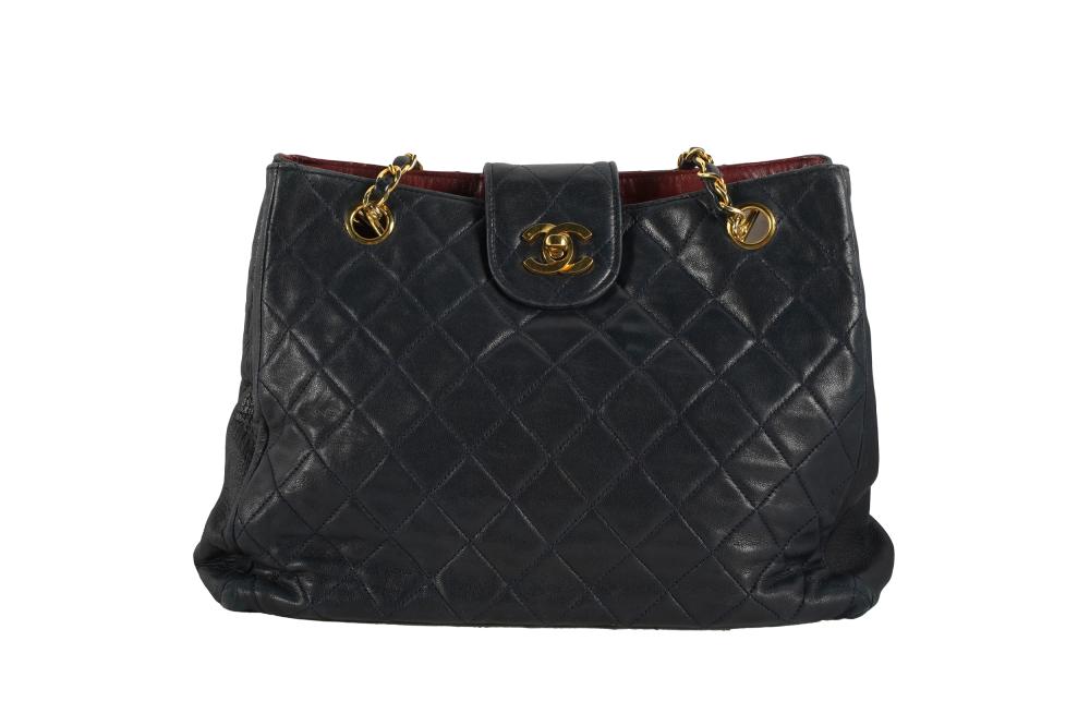 Appraisal: CHANEL NAVY QUILTED LEATHER HANDBAGworn hologram with illegible serial number