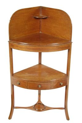 Appraisal: A th century mahogany bowfront corner washstand inlaid stringing in