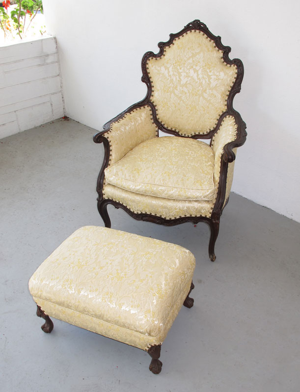 Appraisal: CARVED FRENCH FAUTEIL AND OTTOMAN Fauteil chair with carved and