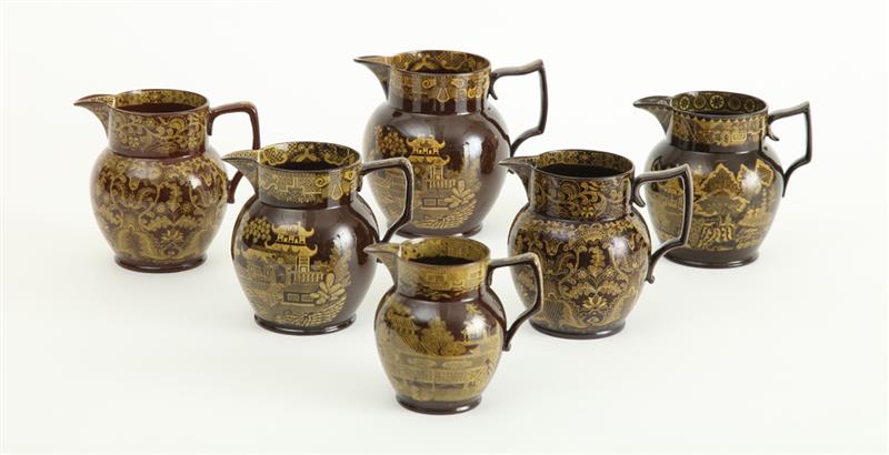 Appraisal: GROUP OF SIX STAFFORDSHIRE BROWN-GLAZED YELLOW TRANSFERWARE ADMIRAL NELSON JUGS