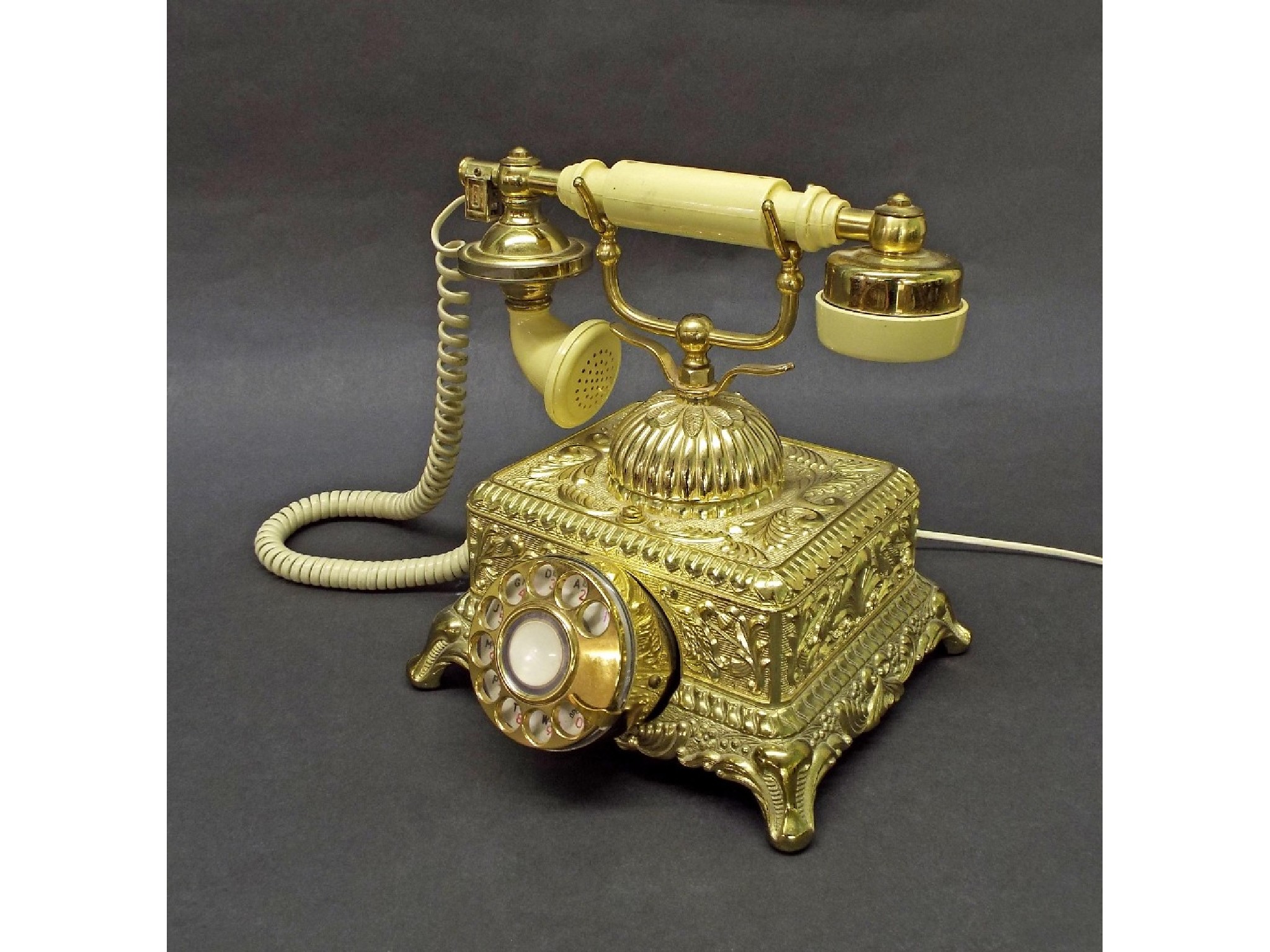 Appraisal: Flamboyant gilt vintage style telephone the base embossed with floral