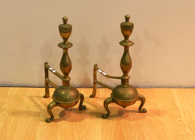 Appraisal: A pair of brass fire dogs