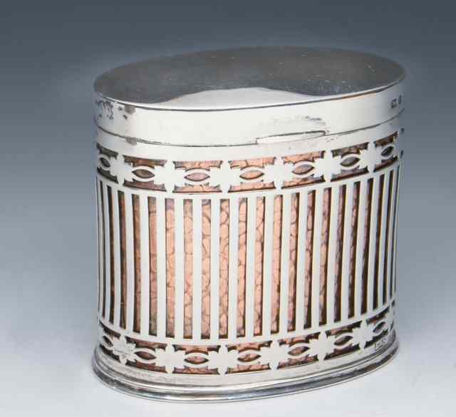 Appraisal: AN OVAL SILVER CIGARETTE CAN with pierced sides and foliate