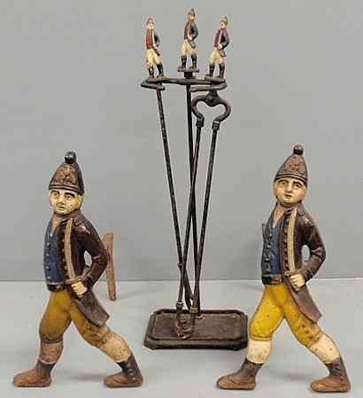 Appraisal: Pair of cast iron andirons with American Revolutionary War soldiers