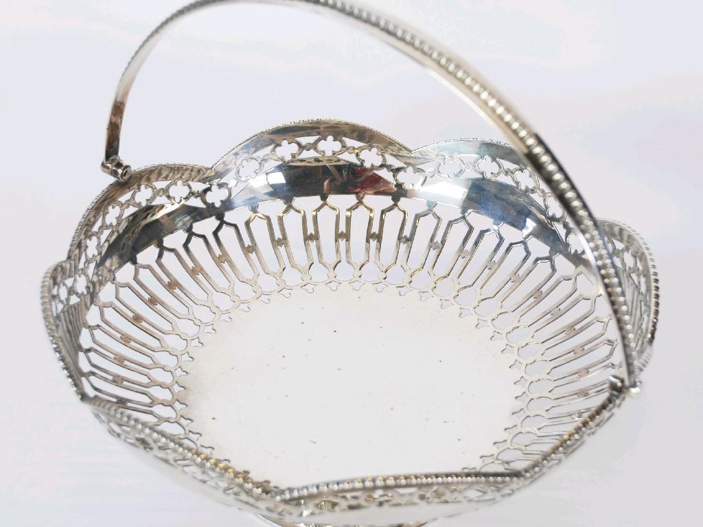 Appraisal: SILVER CAKE BASKET circular with swing handle bead and bar