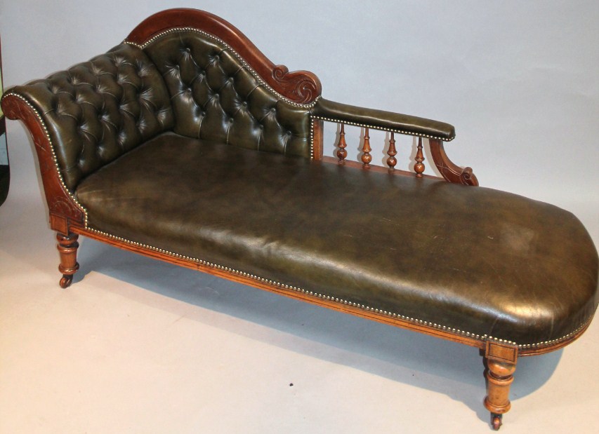 Appraisal: A Victorian mahogany framed chaise longue with scroll arm and