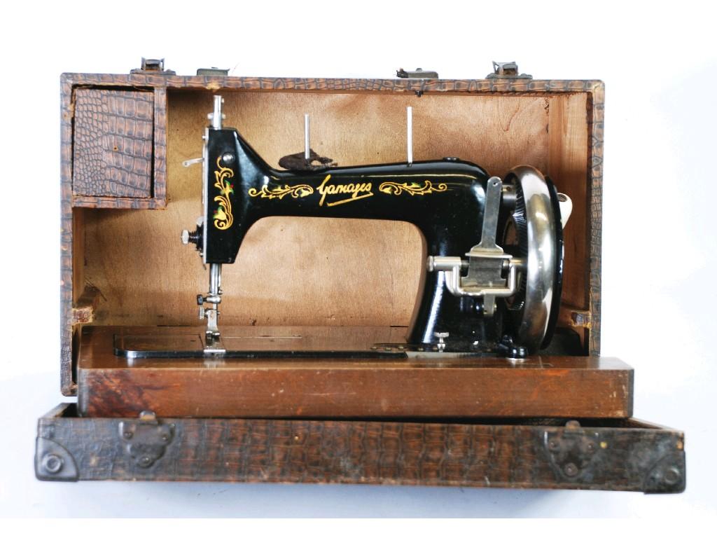 Appraisal: BYGONE SINGER SEWING MACHINE in oak dome top case EST