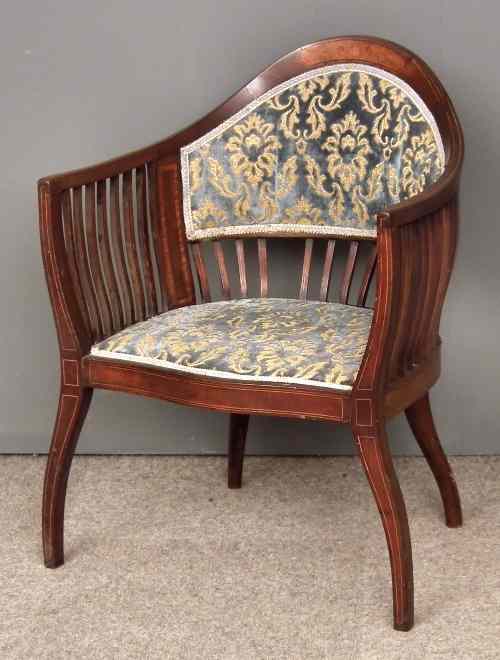 Appraisal: An Edwardian mahogany tub shaped drawing room armchair the shaped