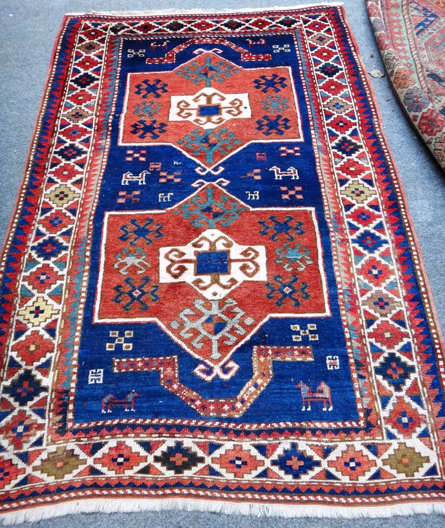 Appraisal: A Fachralo Kazak rug Caucasian the indigo field with two