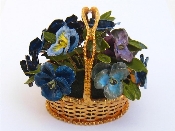 Appraisal: A gilt metal and enamel ornament modelled as a basket