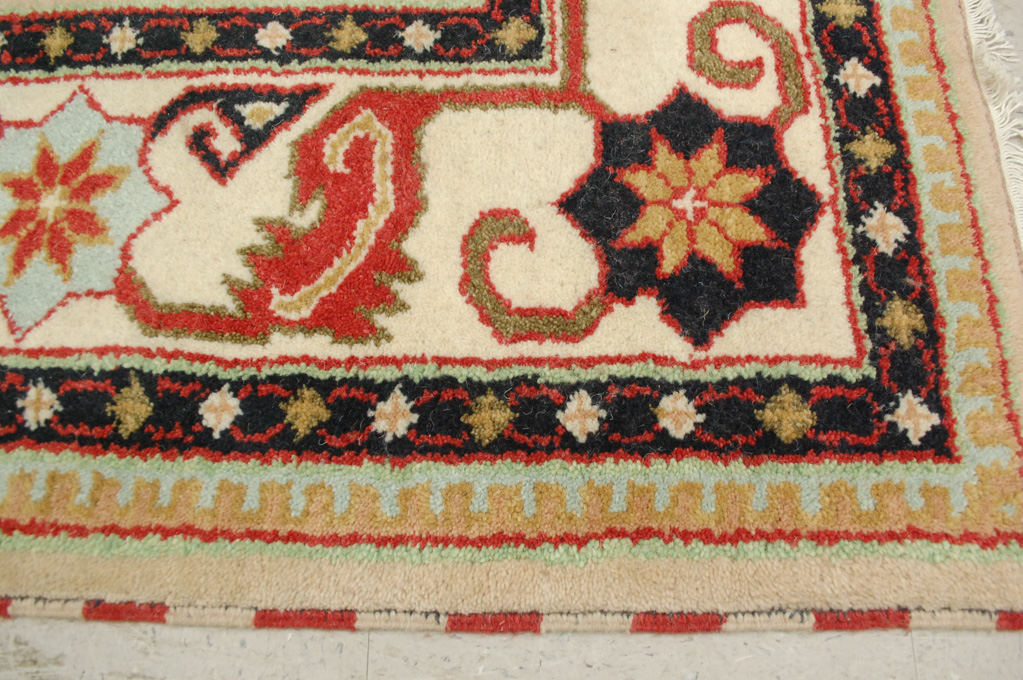 Appraisal: HAND KNOTTED ORIENTAL CARPET Indo-Persian colorful three geometric medallion design