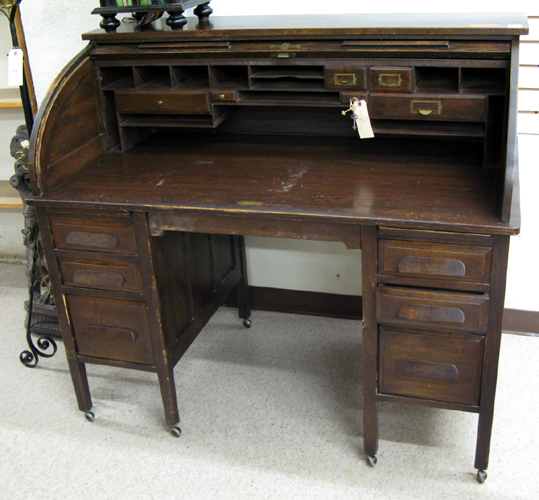 Appraisal: A DARK OAK ROLL TOP DESK American or English early