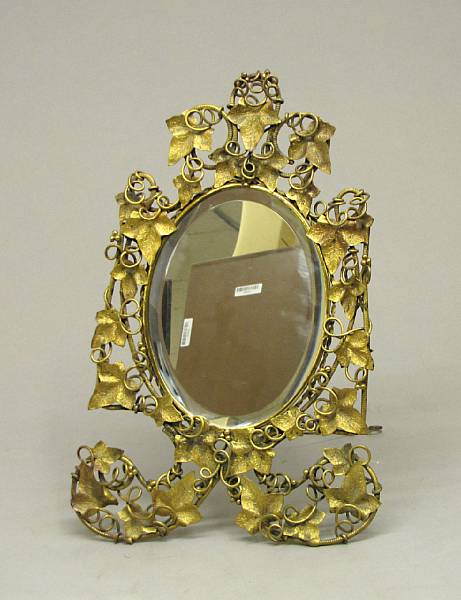 Appraisal: A gilt metal ladies dressing mirror early th century The