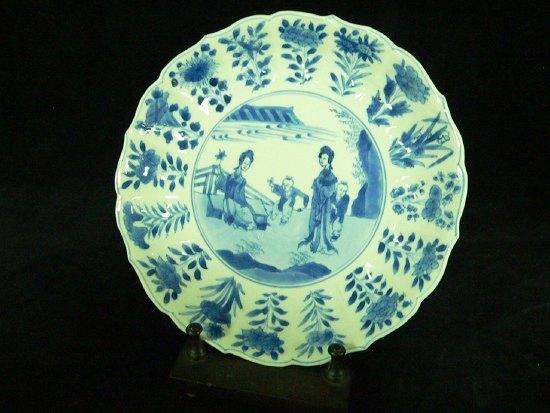 Appraisal: A K'ang Hsi saucer shaped dish with central scene of