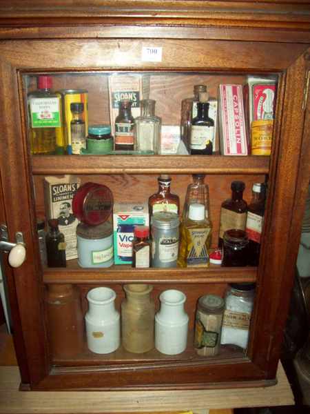 Appraisal: A ONE DOOR MAHOGANY MEDICINE CABINET INCLUDING MEDICINE BOTTLES CERAMIC