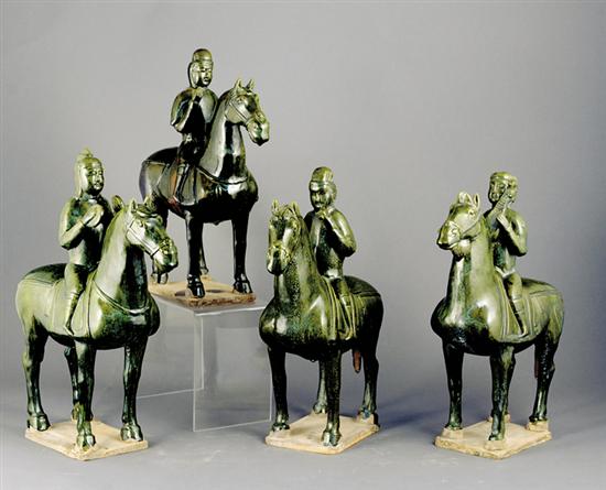 Appraisal: Four Chinese style ceramic roof decorations depicting soldiers on horseback