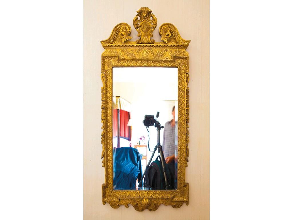 Appraisal: A GEORGE II GILTWOOD AND GESSO MIRROR with a bevelled