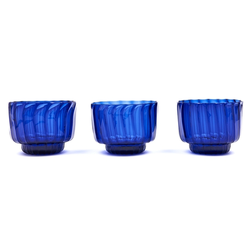 Appraisal: A set of three English spirally fluted blue glass finger